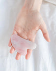 Experience the rejuvenating effects of facial contouring with our Rose Quartz Gua Sha tool, enhancing your natural beauty